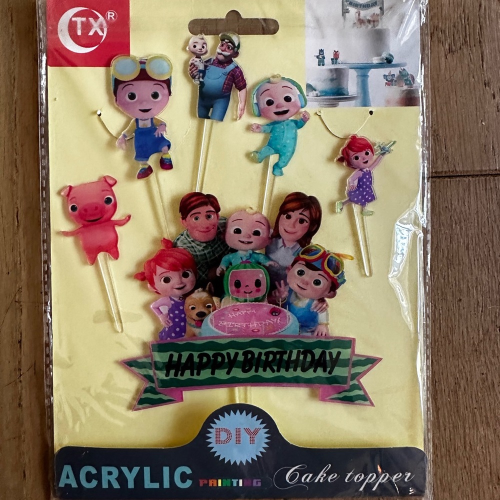 5/$20* Cocomelon character banner & acrylic cake/cupcake toppers. 7 piece set.